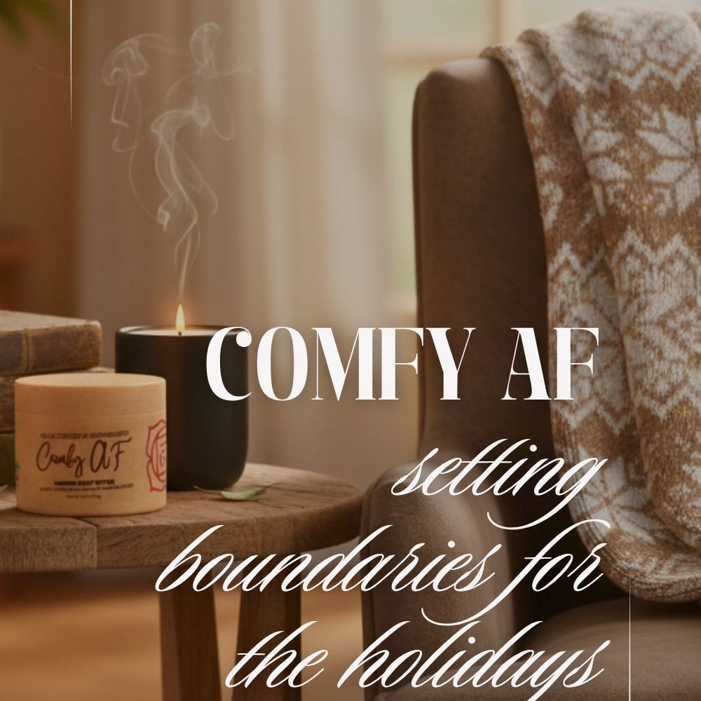 A candle lit on a table, surrounded by a cozy setting with a couch and pillows. 